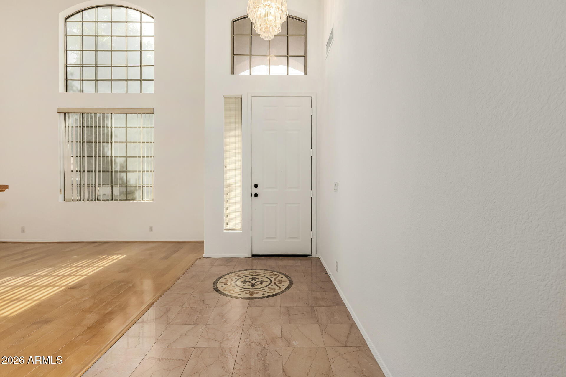 3962 East Agave Road Phoenix, AZ 85044 - Photo 6 of 54 an empty room with windows