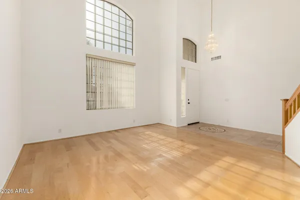 a view of empty room with a fireplace and fan