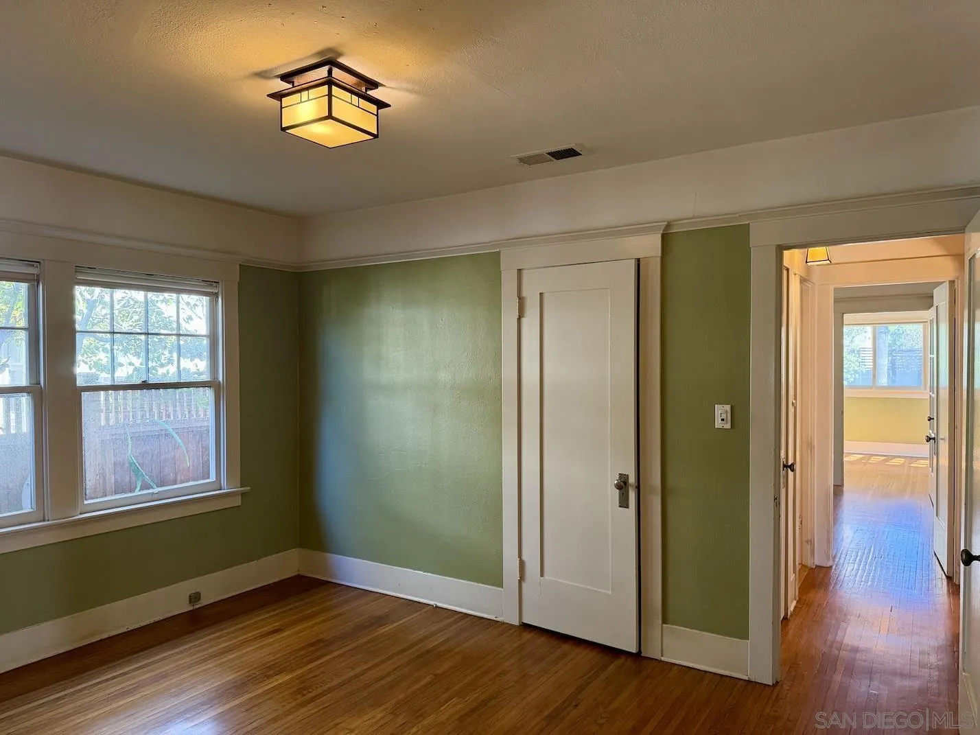 3917 Hawk Street San Diego, CA 92103 - Photo 12 of 40 a view of a room with wooden floor and window
