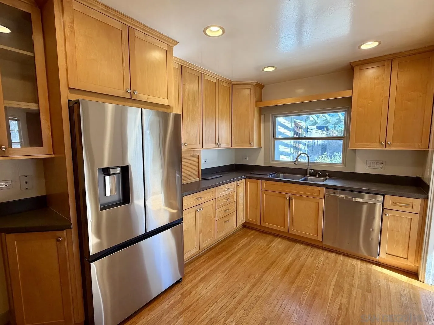 3917 Hawk Street San Diego, CA 92103 - Photo 13 of 40 a kitchen with stainless steel appliances granite countertop a refrigerator a sink and a stove