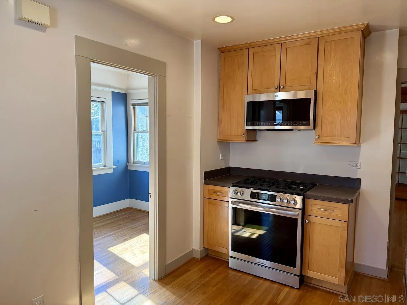 3917 Hawk Street San Diego, CA 92103 - Photo 14 of 40 a kitchen with a stove and a microwave
