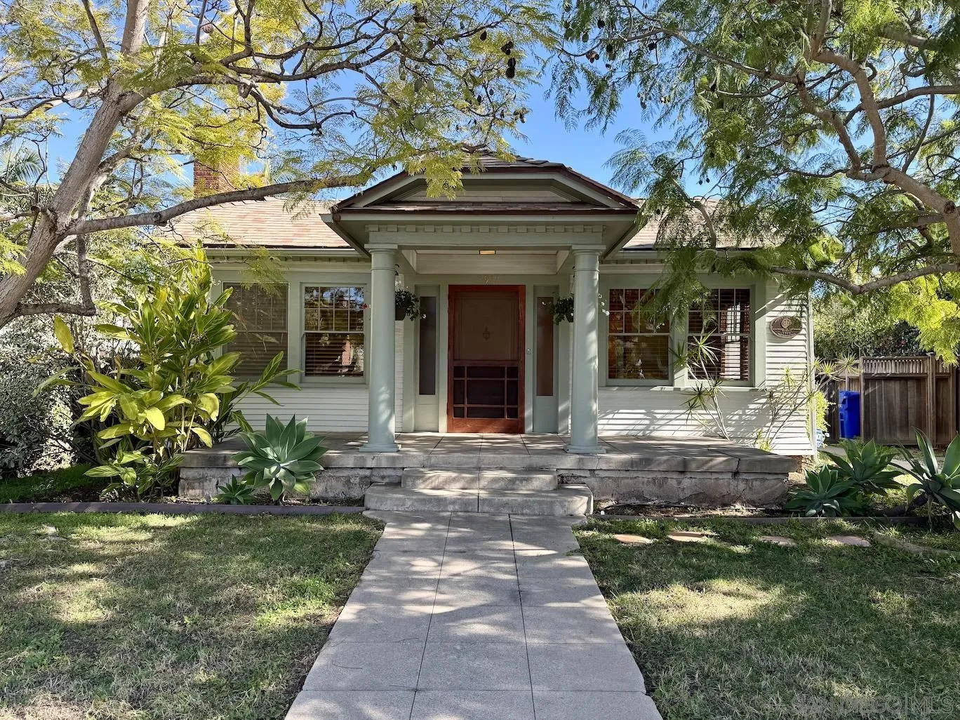 3917 Hawk Street San Diego, CA 92103 - Photo 2 of 40 a front view of a house with a garden