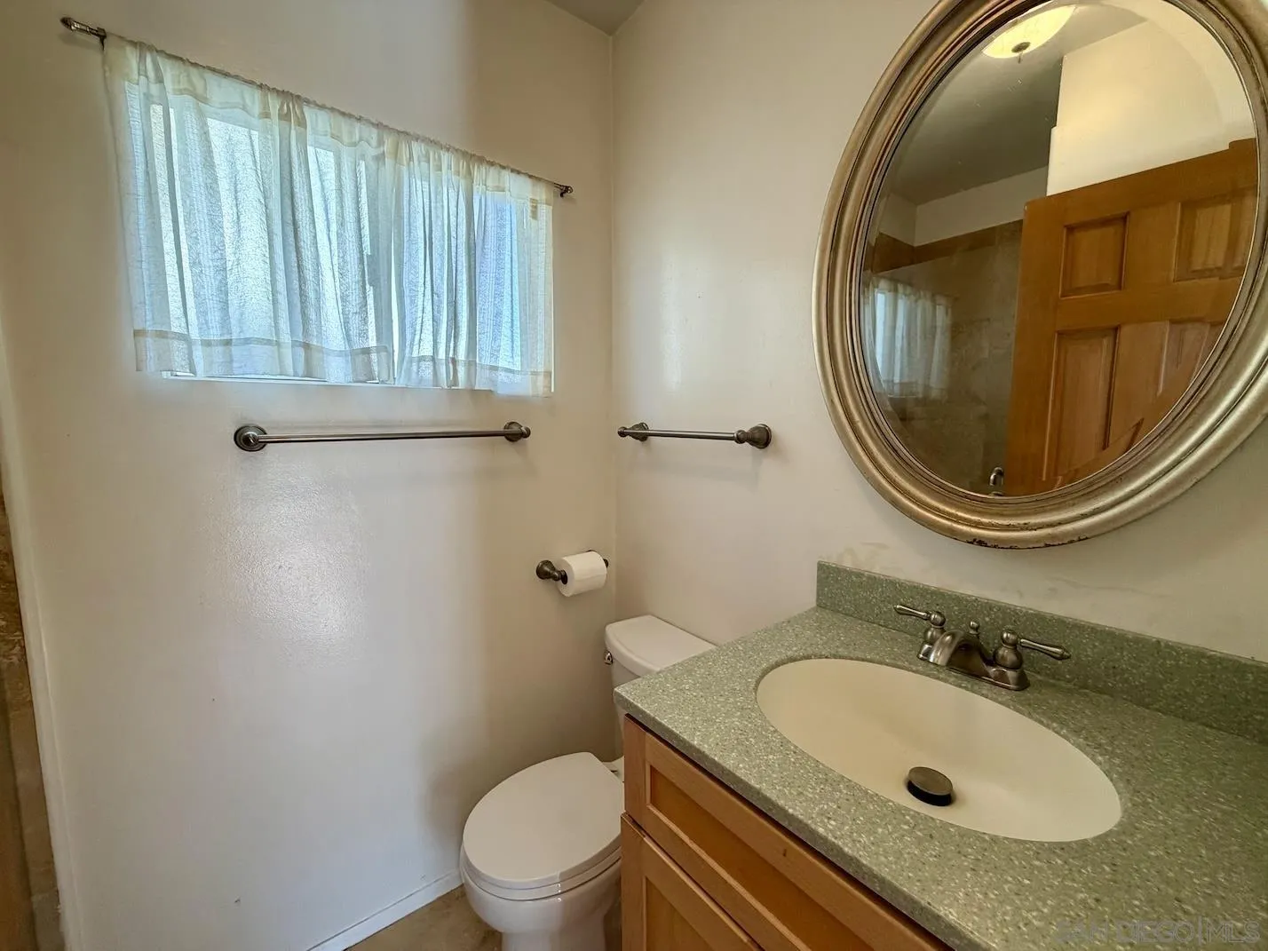 3917 Hawk Street San Diego, CA 92103 - Photo 23 of 40 a bathroom with a sink and a mirror