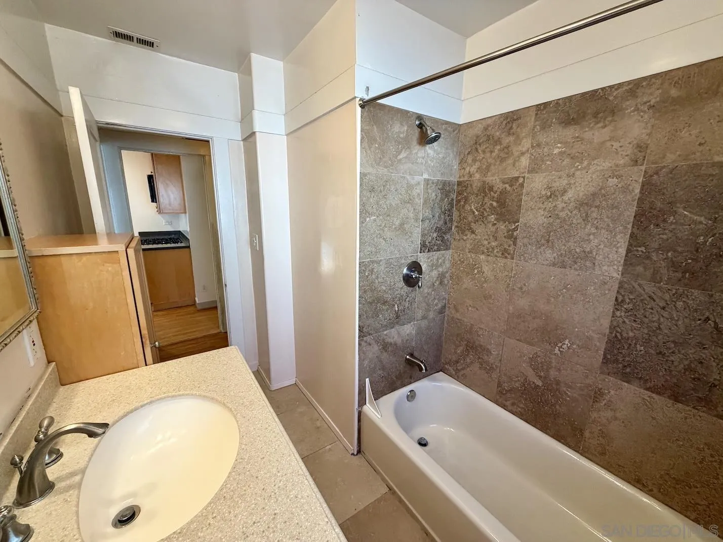 3917 Hawk Street San Diego, CA 92103 - Photo 24 of 40 a bathroom with a sink and a tub