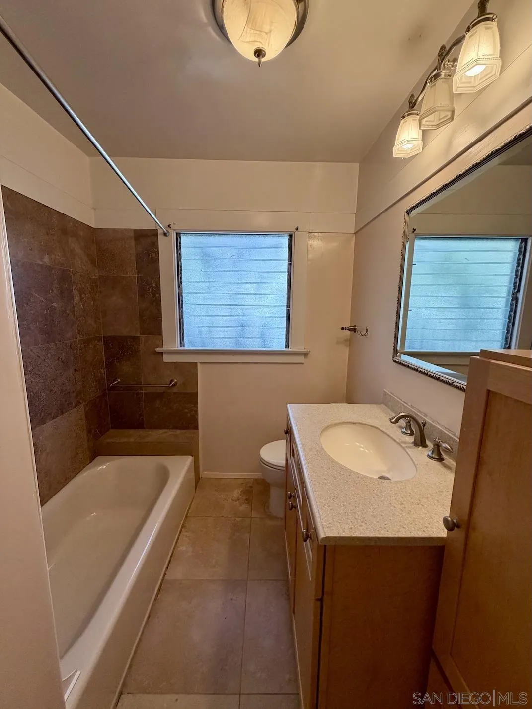 3917 Hawk Street San Diego, CA 92103 - Photo 25 of 40 a bathroom with a sink and a bathtub