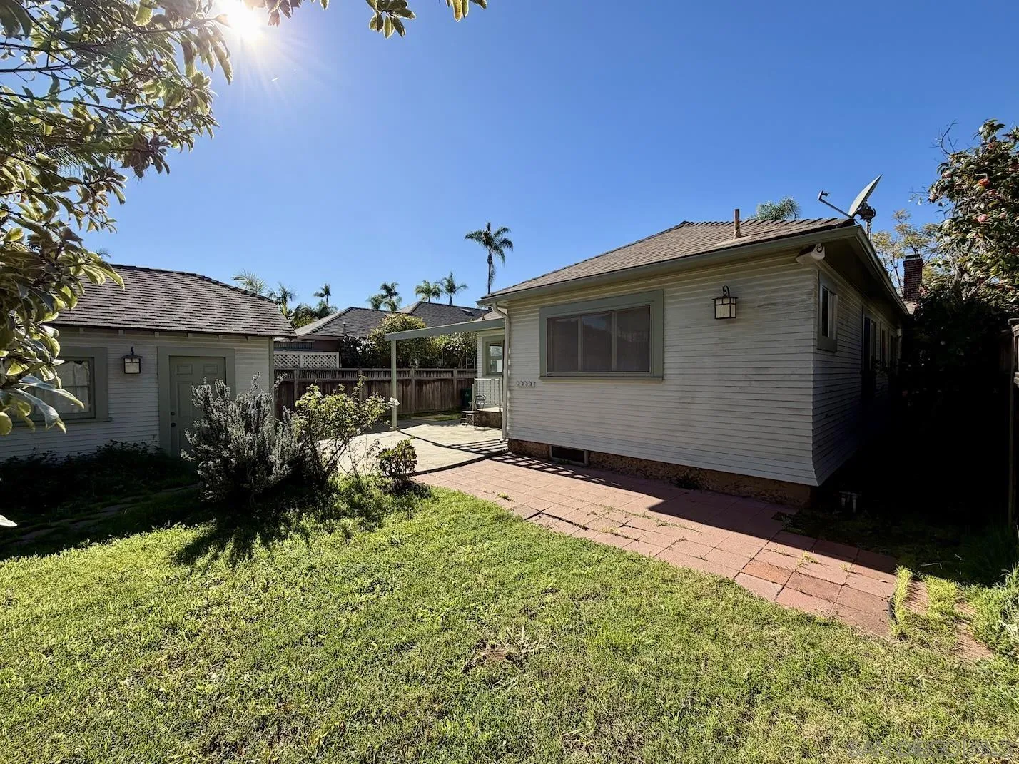 3917 Hawk Street San Diego, CA 92103 - Photo 30 of 40 a backyard of a house with table and chairs