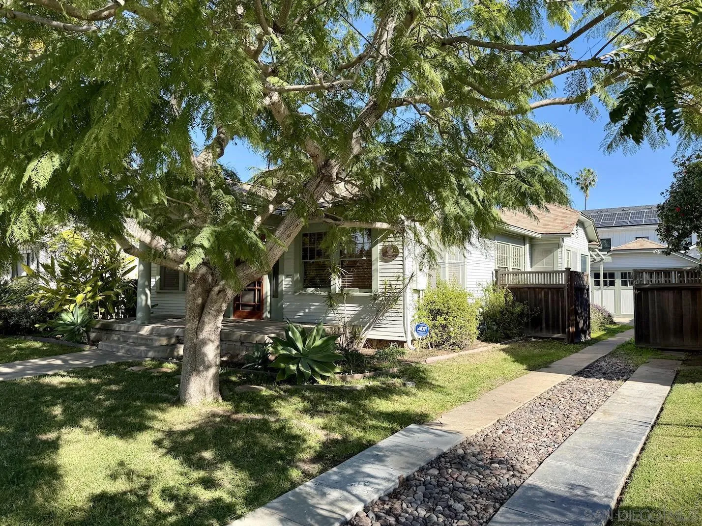 3917 Hawk Street San Diego, CA 92103 - Photo 34 of 40 a backyard of a house with yard and outdoor seating
