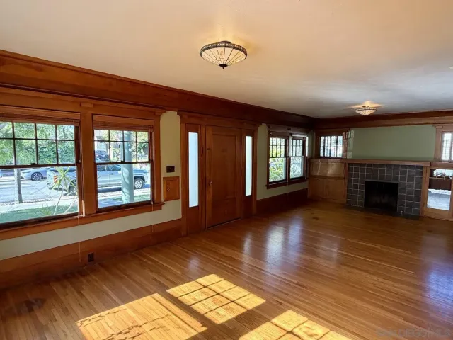 a hallway with a stove top oven and cabinets
