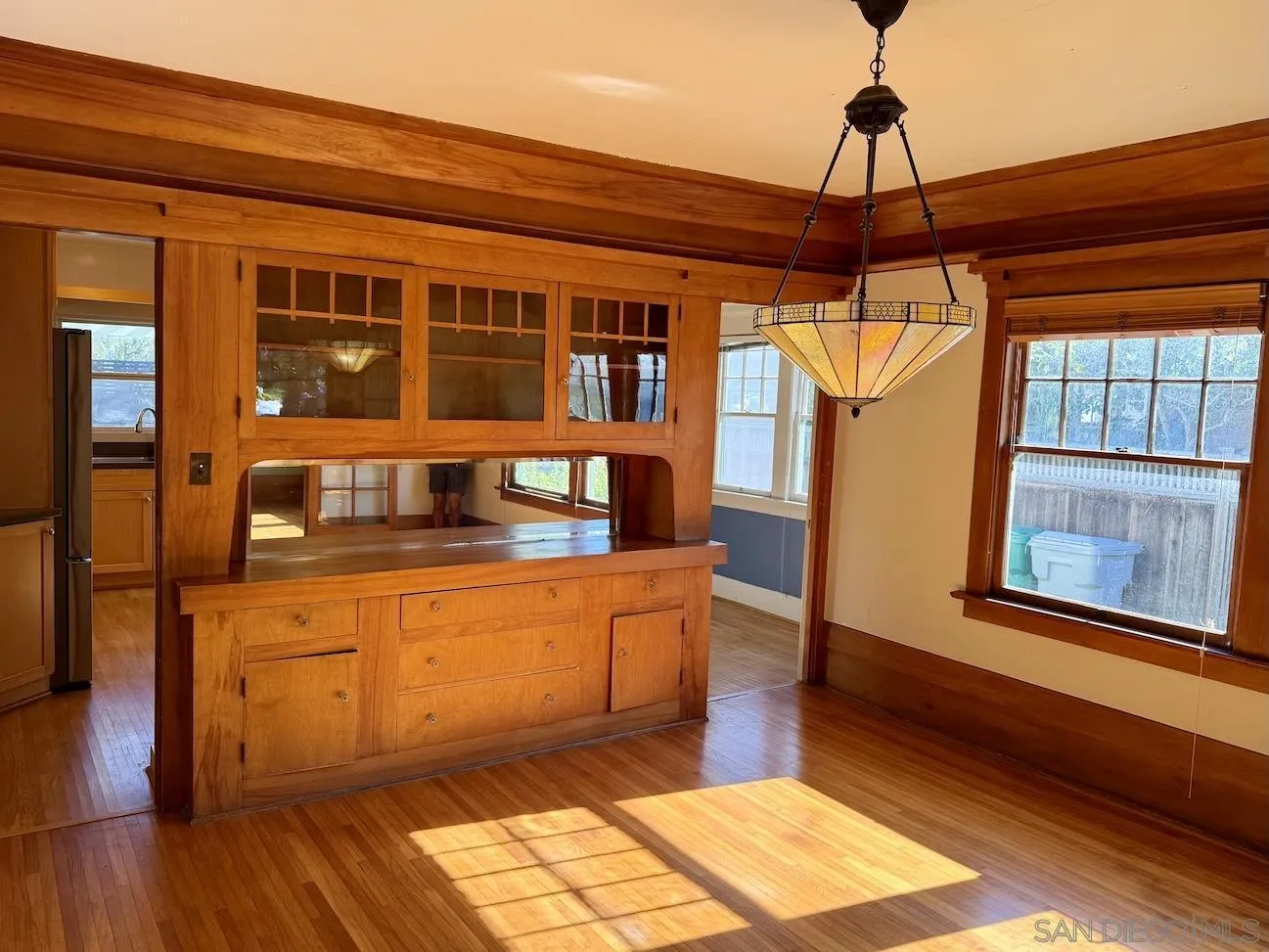 3917 Hawk Street San Diego, CA 92103 - Photo 9 of 40 a hallway with a stove top oven and cabinets