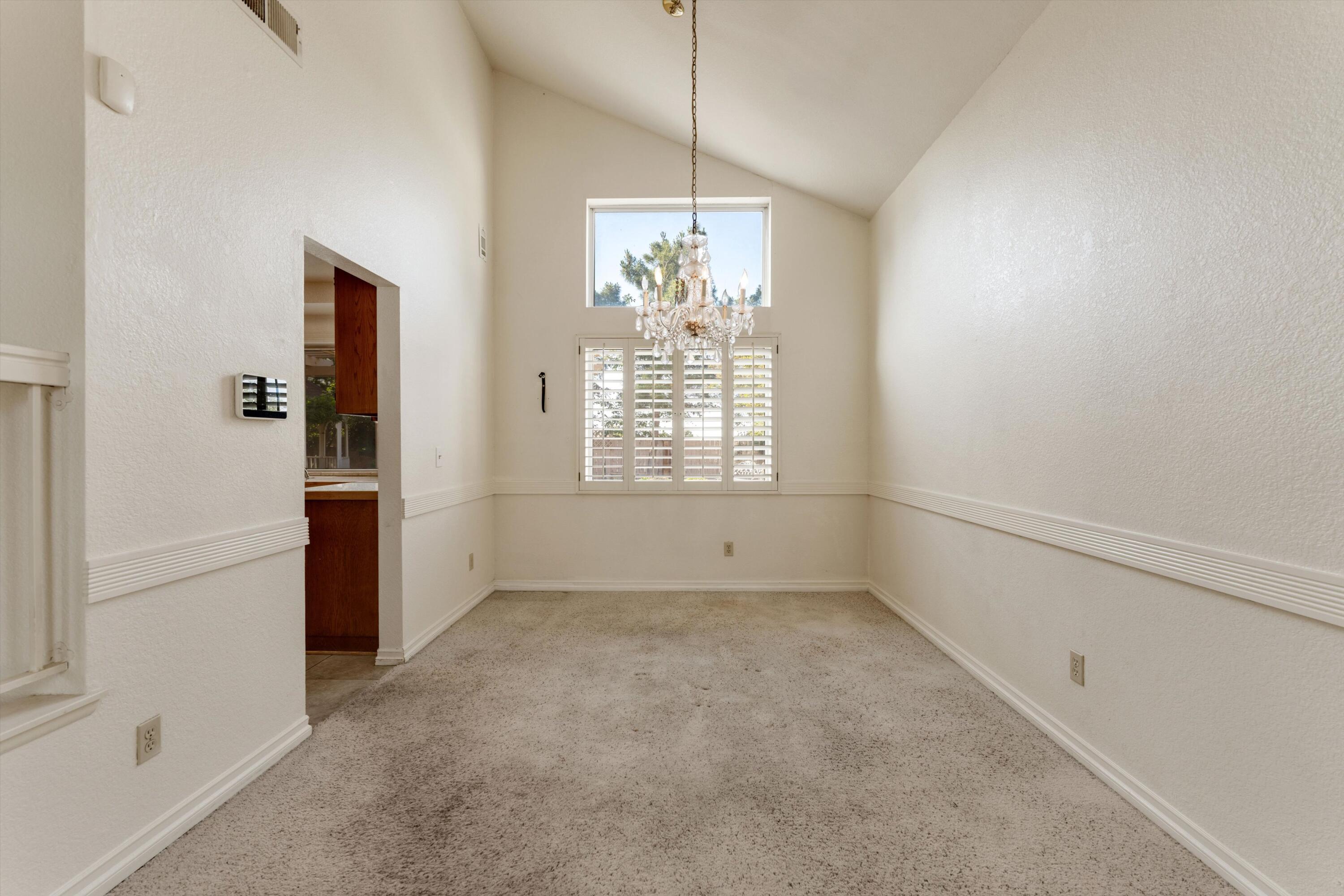 3229 Quarry Road Palmdale, CA 93550 - Photo 11 of 32 an empty room with windows and entrance