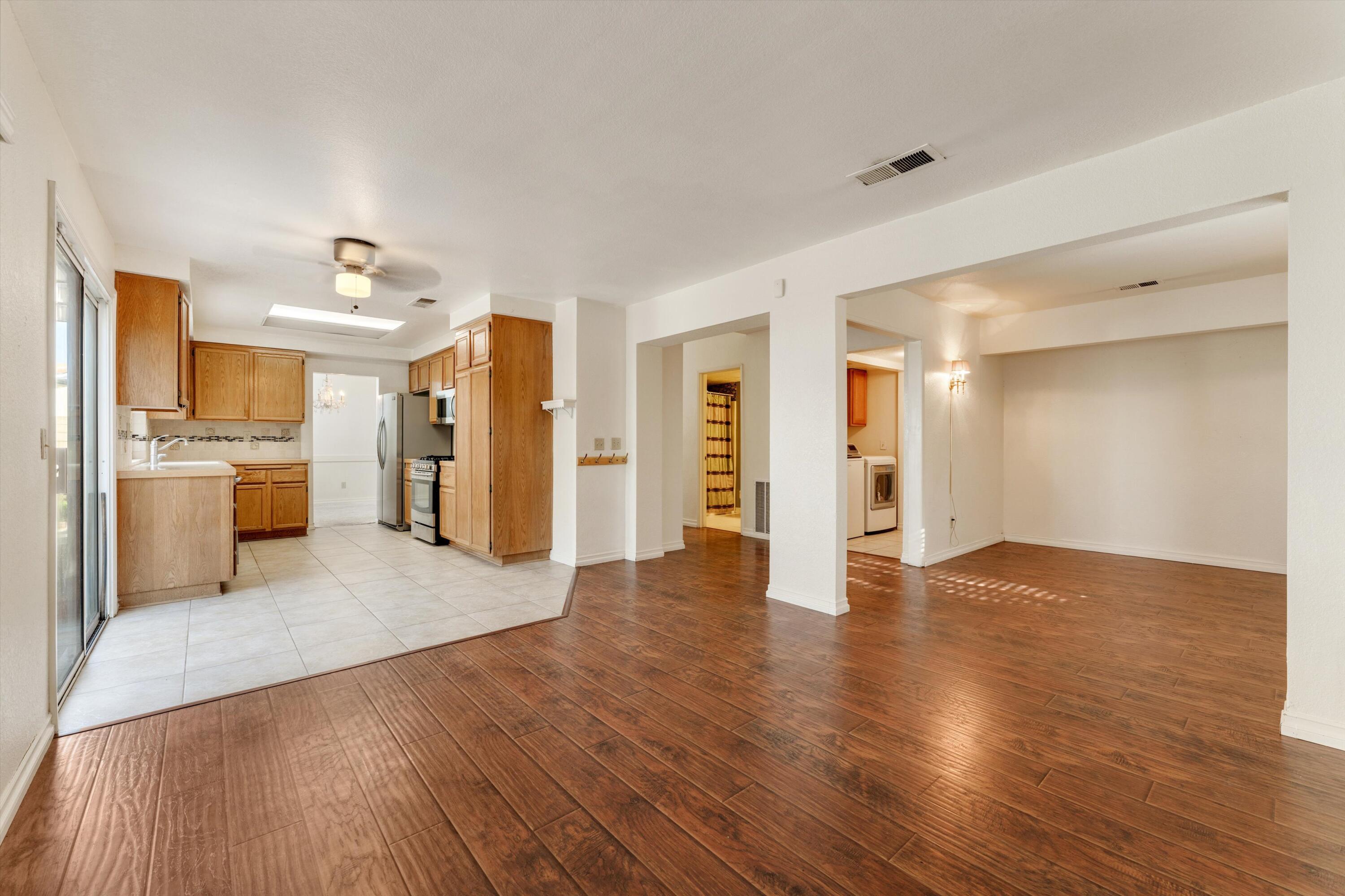3229 Quarry Road Palmdale, CA 93550 - Photo 16 of 32 a view of a kitchen with a sink and a refrigerator