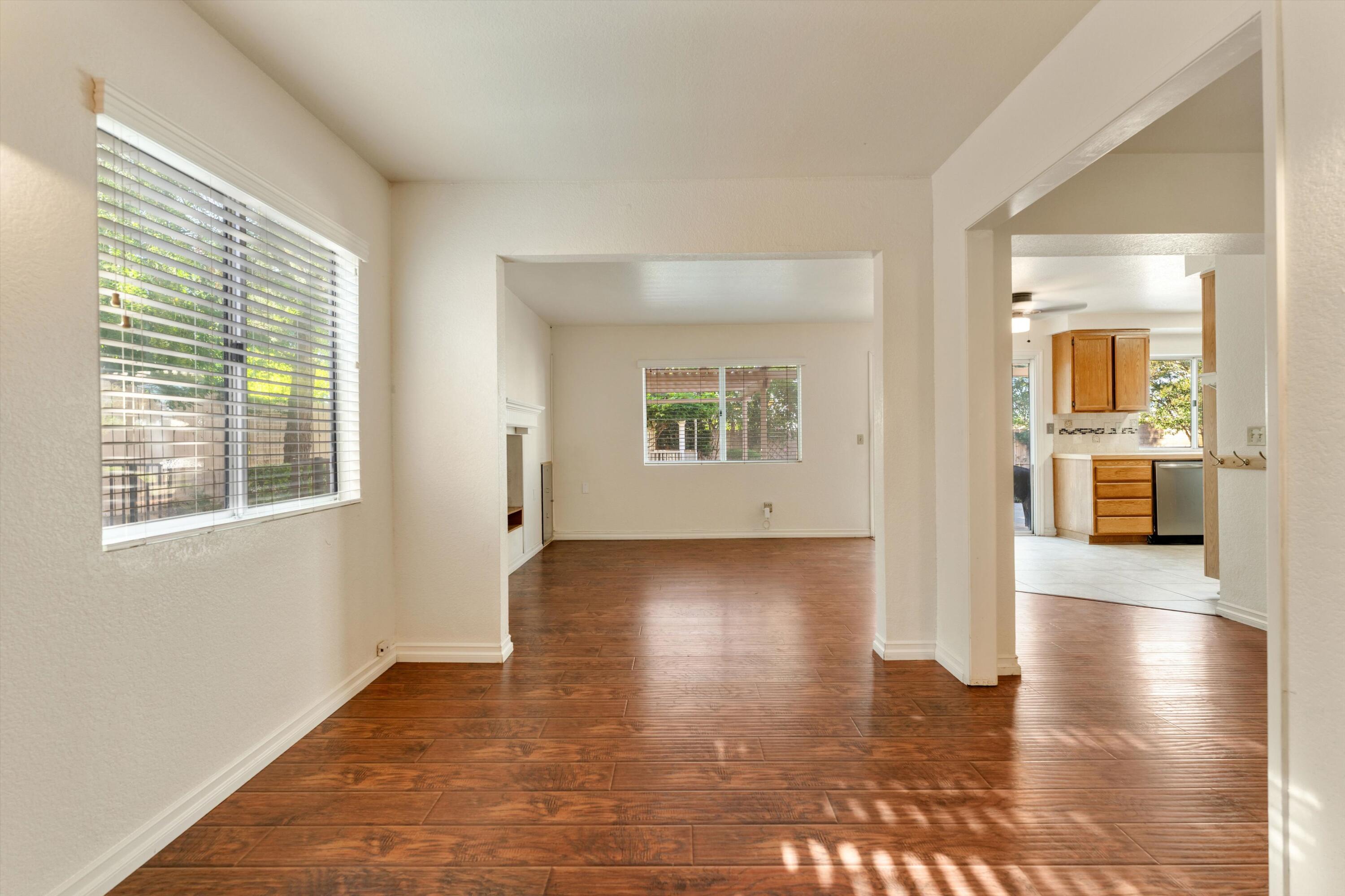 3229 Quarry Road Palmdale, CA 93550 - Photo 18 of 32 a view of a livingroom with wooden floor and a large window