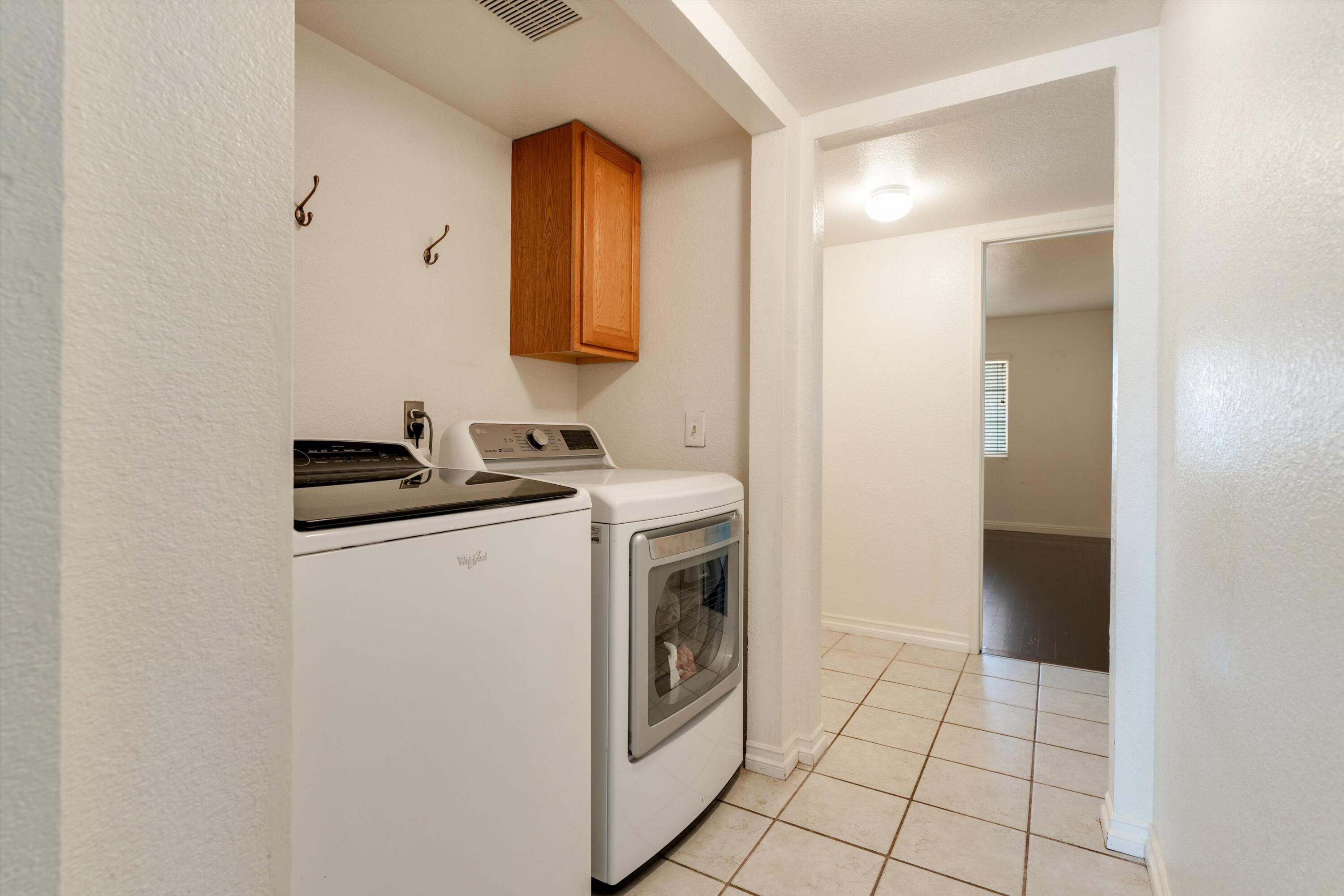 3229 Quarry Road Palmdale, CA 93550 - Photo 19 of 32 a kitchen with a sink a stove and cabinets