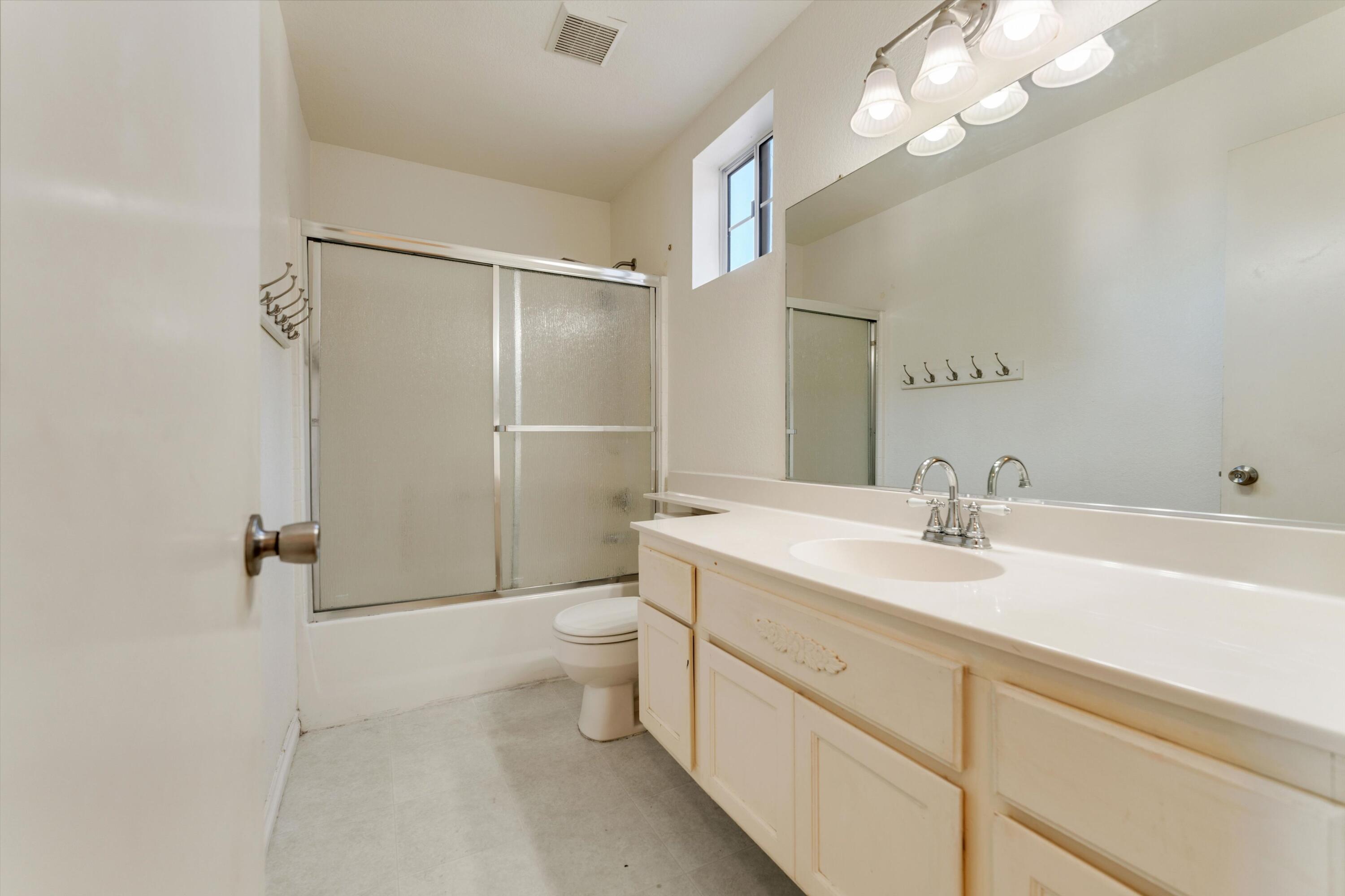 3229 Quarry Road Palmdale, CA 93550 - Photo 26 of 32 a bathroom with a sink a toilet and shower