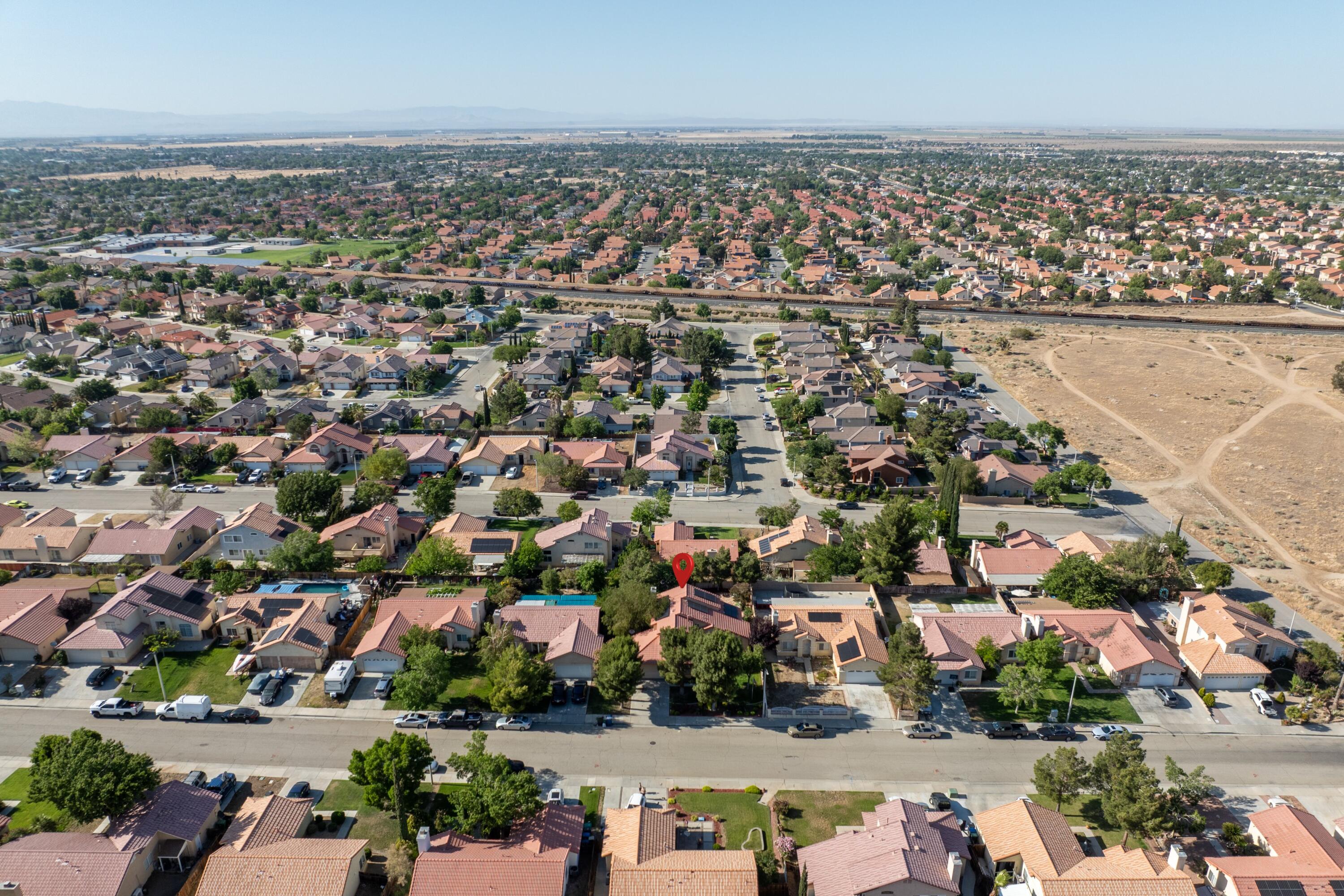 3229 Quarry Road Palmdale, CA 93550 - Photo 6 of 32 an aerial view of a city with lots of residential buildings