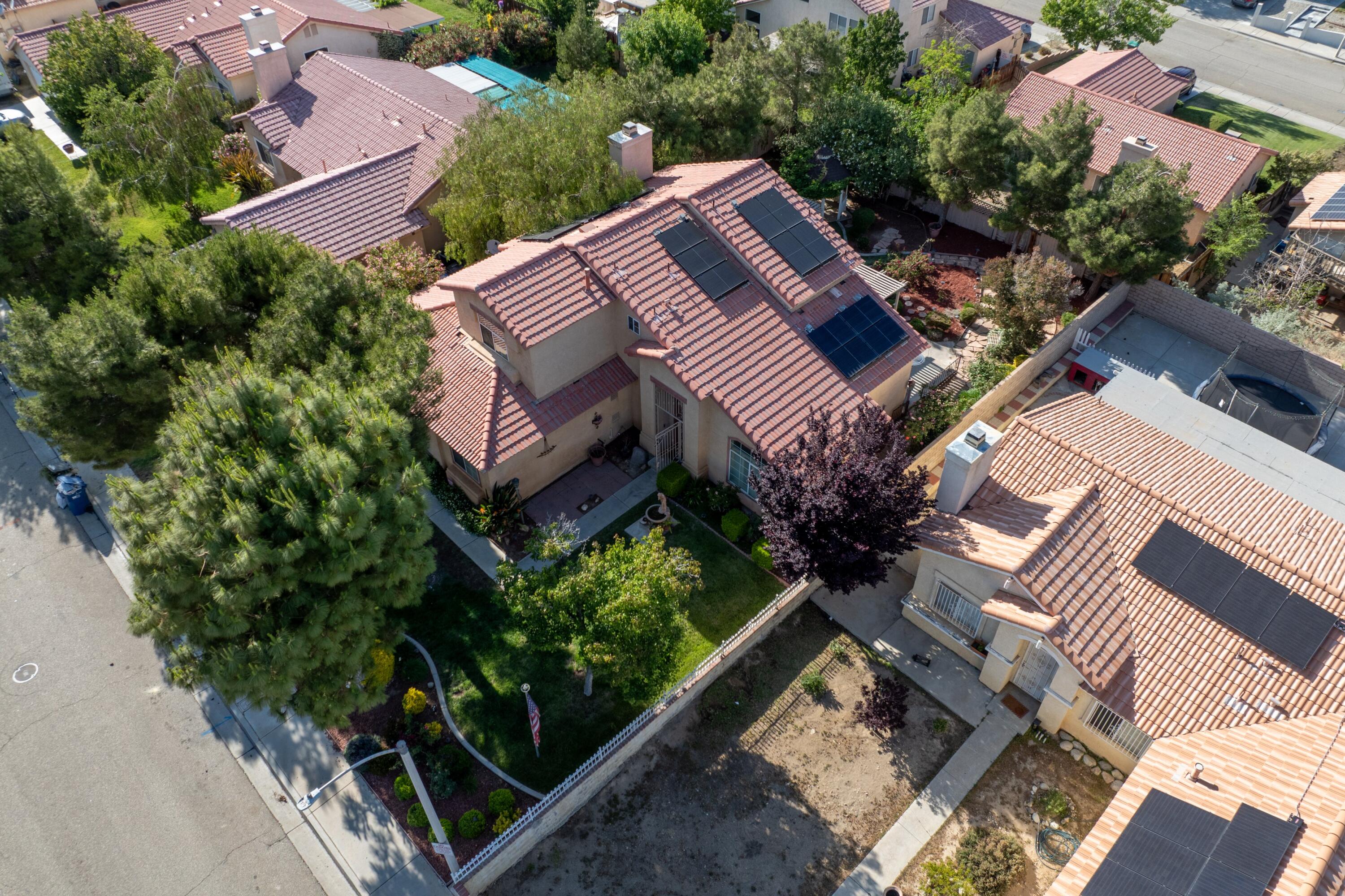 3229 Quarry Road Palmdale, CA 93550 - Photo 8 of 32 an aerial view of a house with a yard and potted plants