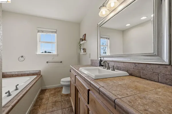 a kitchen with stainless steel appliances a stove a sink and a refrigerator