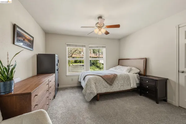 a kitchen with stainless steel appliances granite countertop a refrigerator and a stove