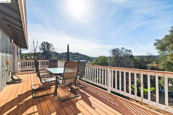 a view of a balcony with chairs