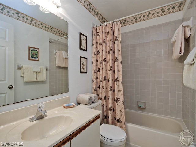 4580 Andover Way Naples, FL 34112 - Photo 11 of 12 a bathroom with a sink a toilet and shower