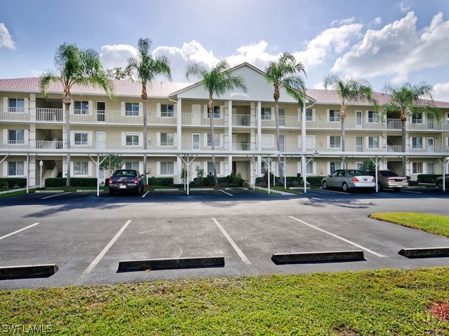 4580 Andover Way Naples, FL 34112 - Photo 12 of 12 a front view of building with yard