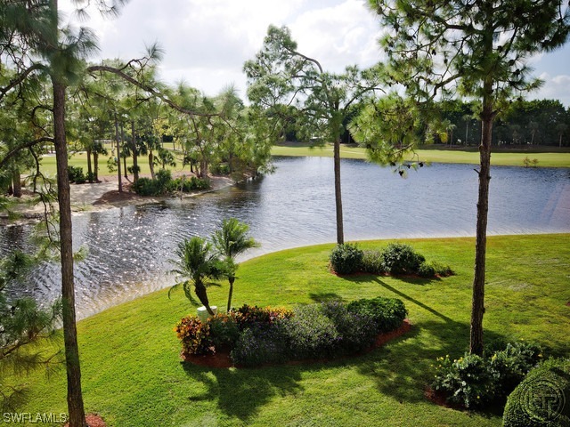 4580 Andover Way Naples, FL 34112 - Photo 2 of 12 a view of a garden with a bench