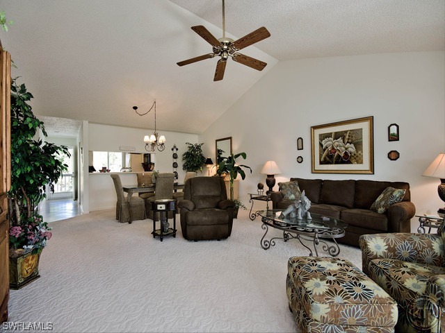 4580 Andover Way Naples, FL 34112 - Photo 4 of 12 a living room with furniture and a potted plant