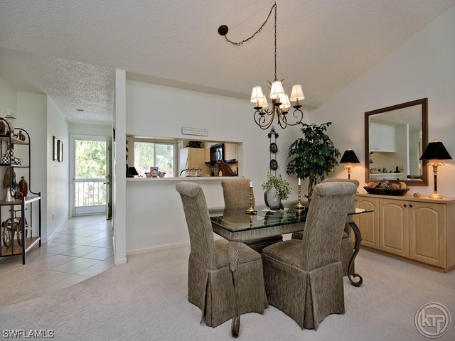 4580 Andover Way Naples, FL 34112 - Photo 6 of 12 a dining room with furniture and window