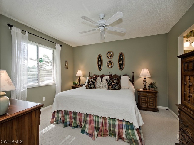 4580 Andover Way Naples, FL 34112 - Photo 8 of 12 a bedroom with a bed and a window