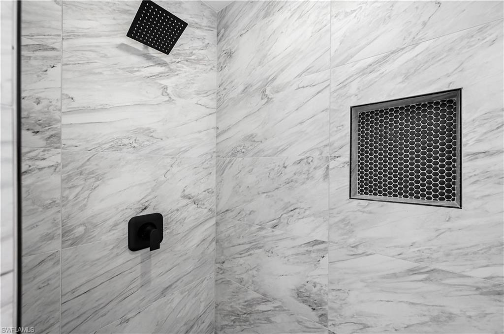 4448 18th Avenue Southwest Naples, FL 34116 - Photo 13 of 28 a bathroom with a shower