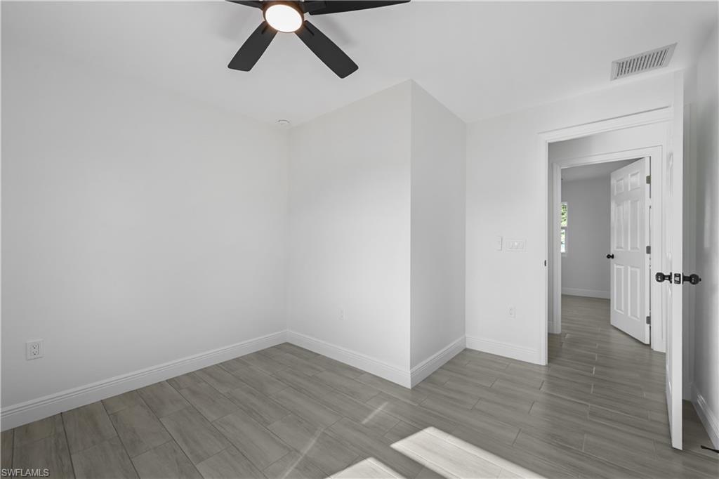 4448 18th Avenue Southwest Naples, FL 34116 - Photo 14 of 28 wooden floor in an empty room