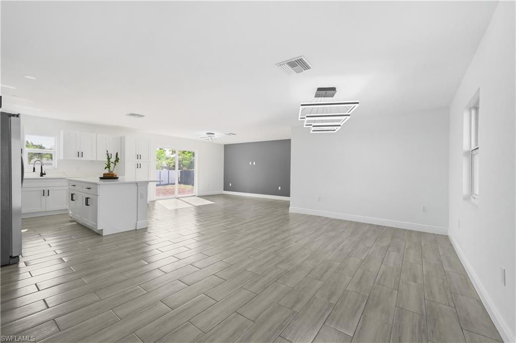 4448 18th Avenue Southwest Naples, FL 34116 - Photo 3 of 28 a view of empty room with wooden floor