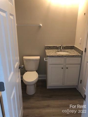 1307 Filbert Street Salisbury, NC 28144 - Photo 10 of 10 a bathroom with a toilet sink and mirror