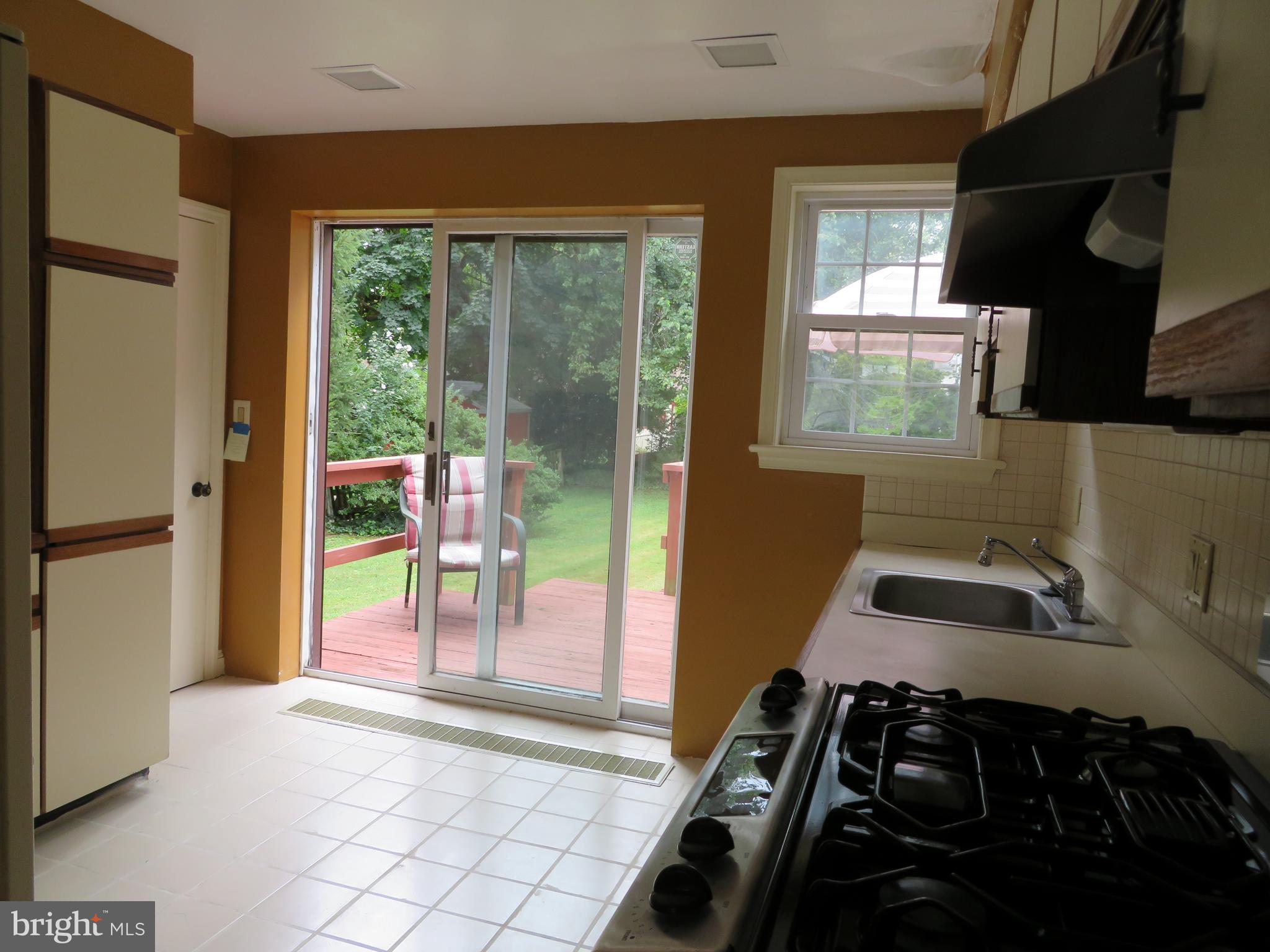 616 Croyden Road Cheltenham, PA 19012 - Photo 11 of 27 Sliders to the outside from the kitchen