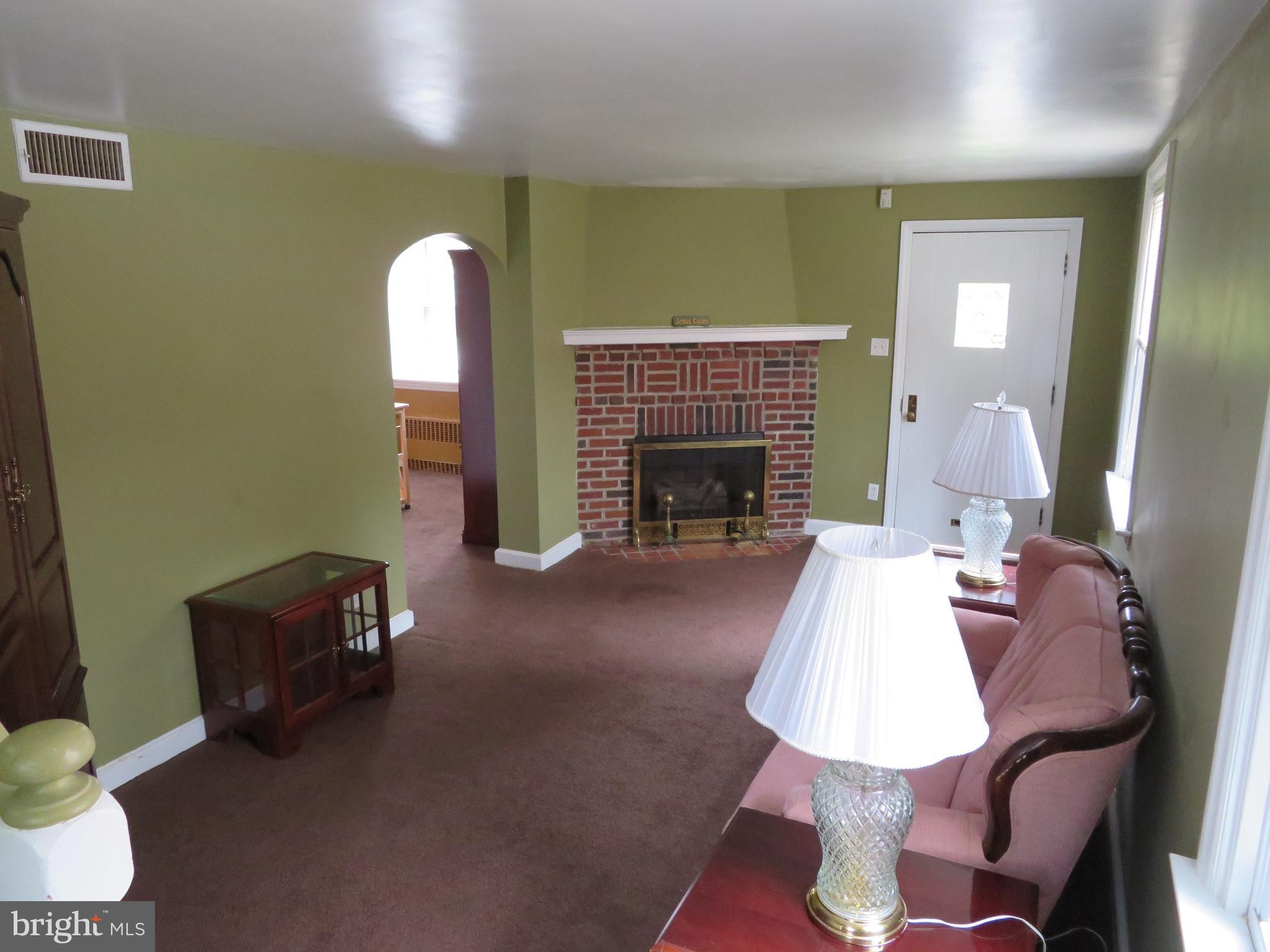 616 Croyden Road Cheltenham, PA 19012 - Photo 5 of 27 Living Room with brick fireplace