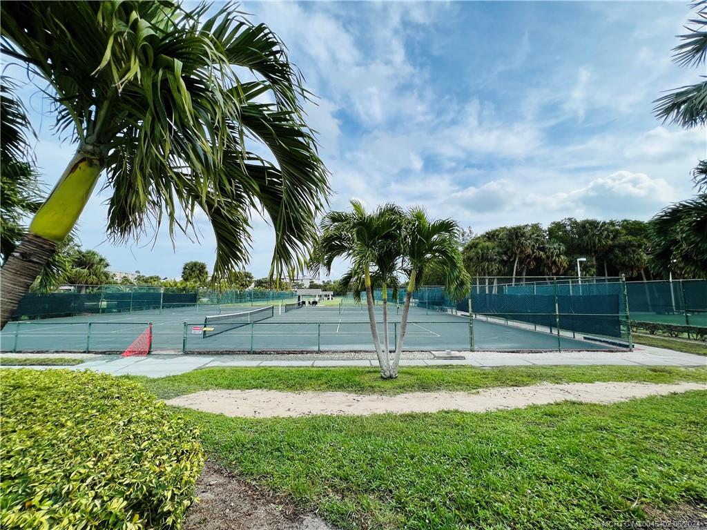 221 Northeast Plantation Road, Unit 215 Stuart, FL 34996 - Photo 76 of 83 a view of a yard with palm trees