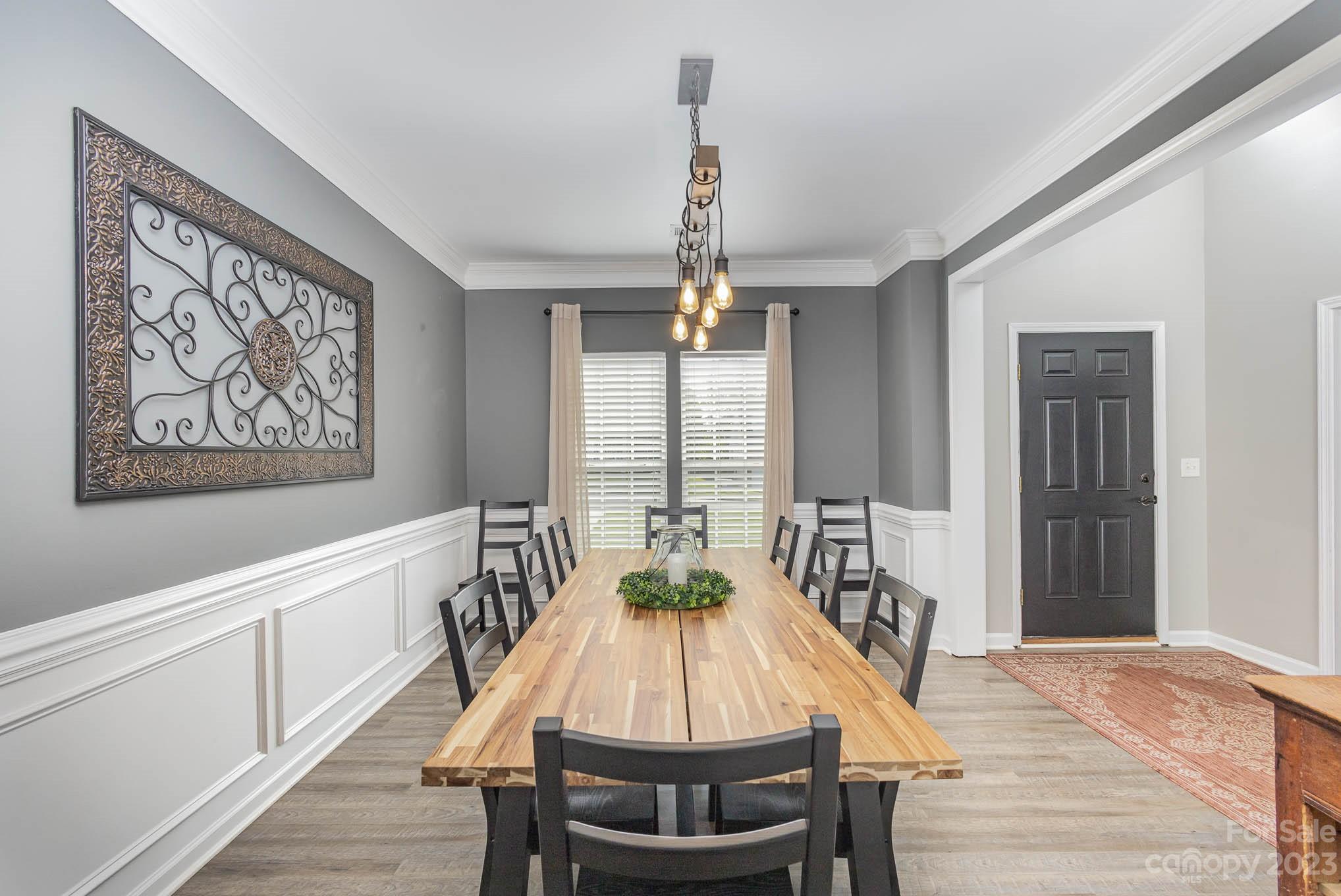 2379 Smith Cove Road Denver, NC 28037 - Photo 14 of 40 a view of a dining room with furniture window and wooden floor
