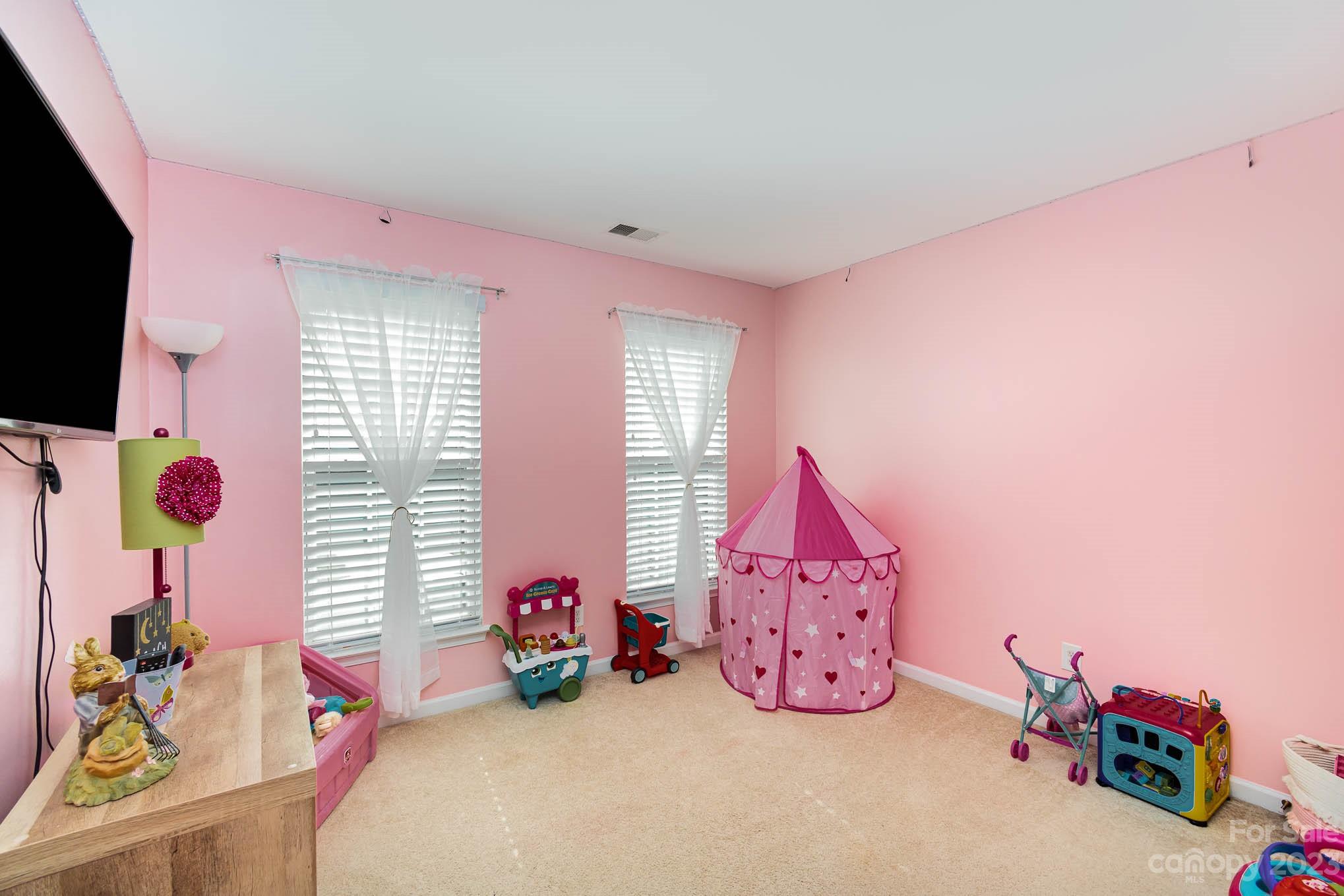 2379 Smith Cove Road Denver, NC 28037 - Photo 27 of 40 a view of a room with toys and a flat screen tv