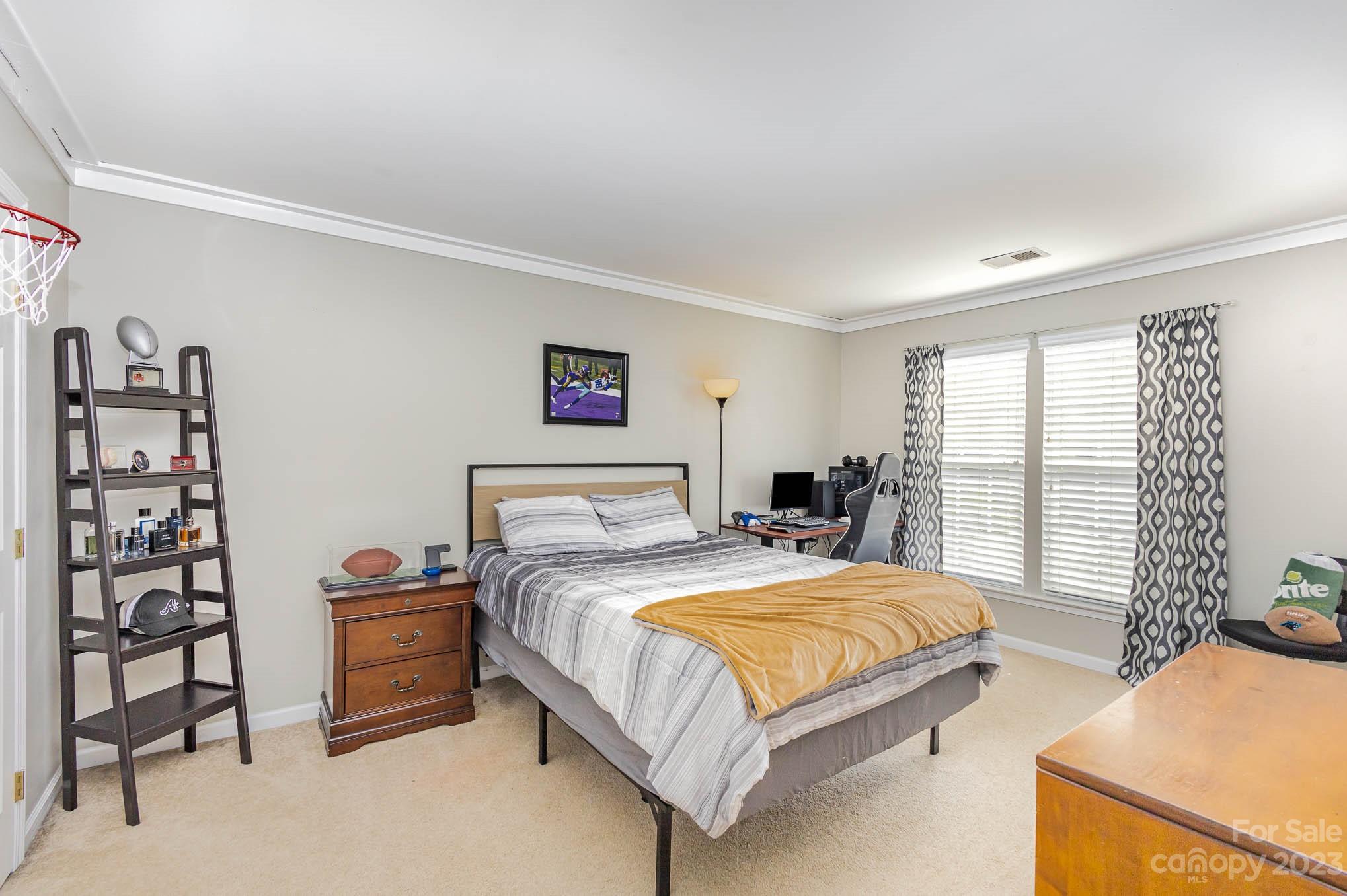 2379 Smith Cove Road Denver, NC 28037 - Photo 28 of 40 a bedroom with a bed and a window