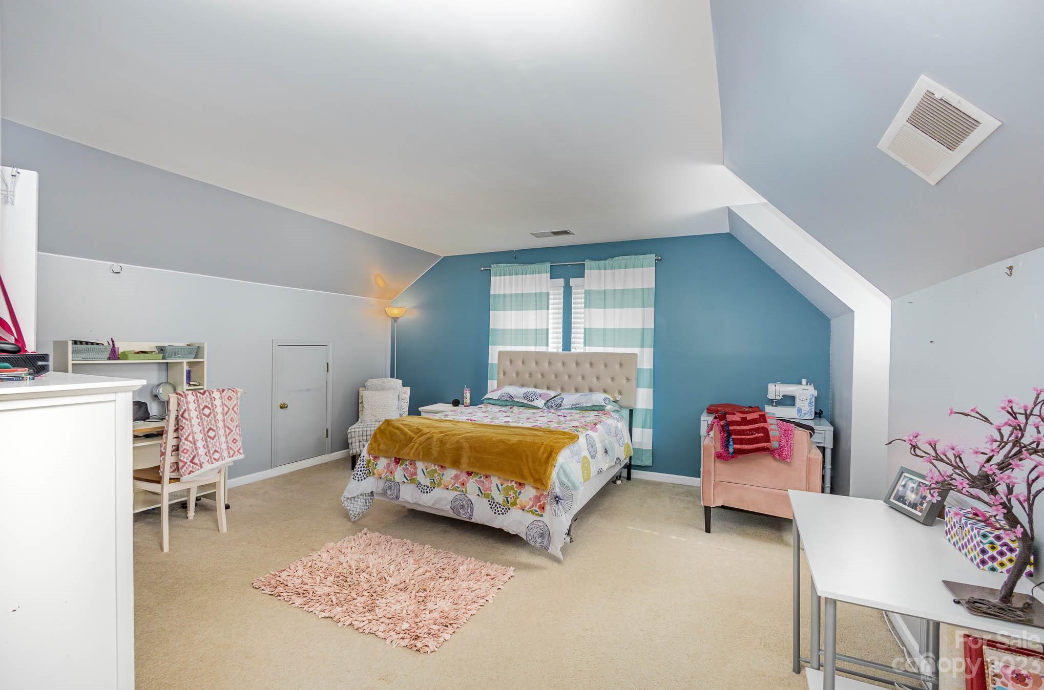 2379 Smith Cove Road Denver, NC 28037 - Photo 29 of 40 a bedroom with furniture and a baby crib