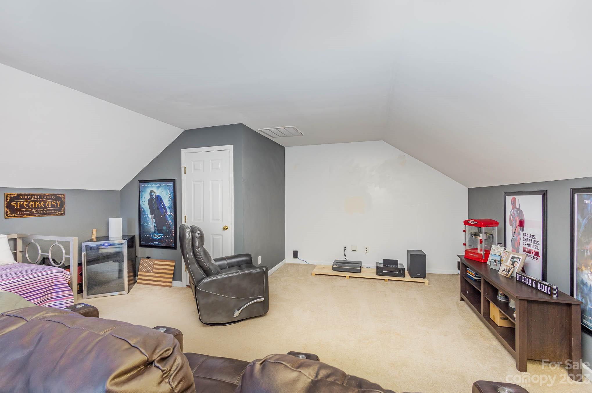 2379 Smith Cove Road Denver, NC 28037 - Photo 32 of 40 a bedroom with furniture and a wooden floor