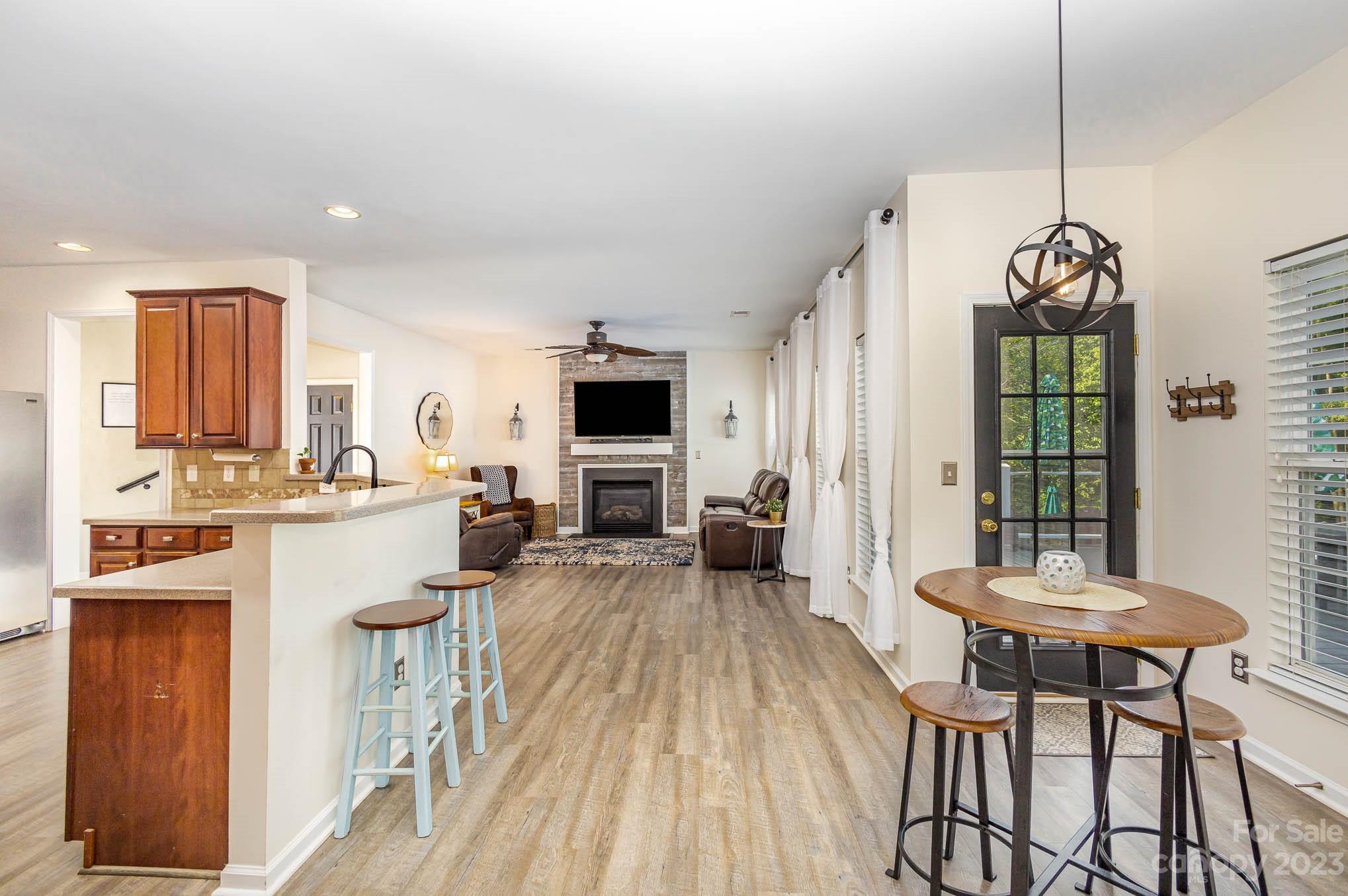 2379 Smith Cove Road Denver, NC 28037 - Photo 9 of 40 a kitchen with sink cabinets and dining table