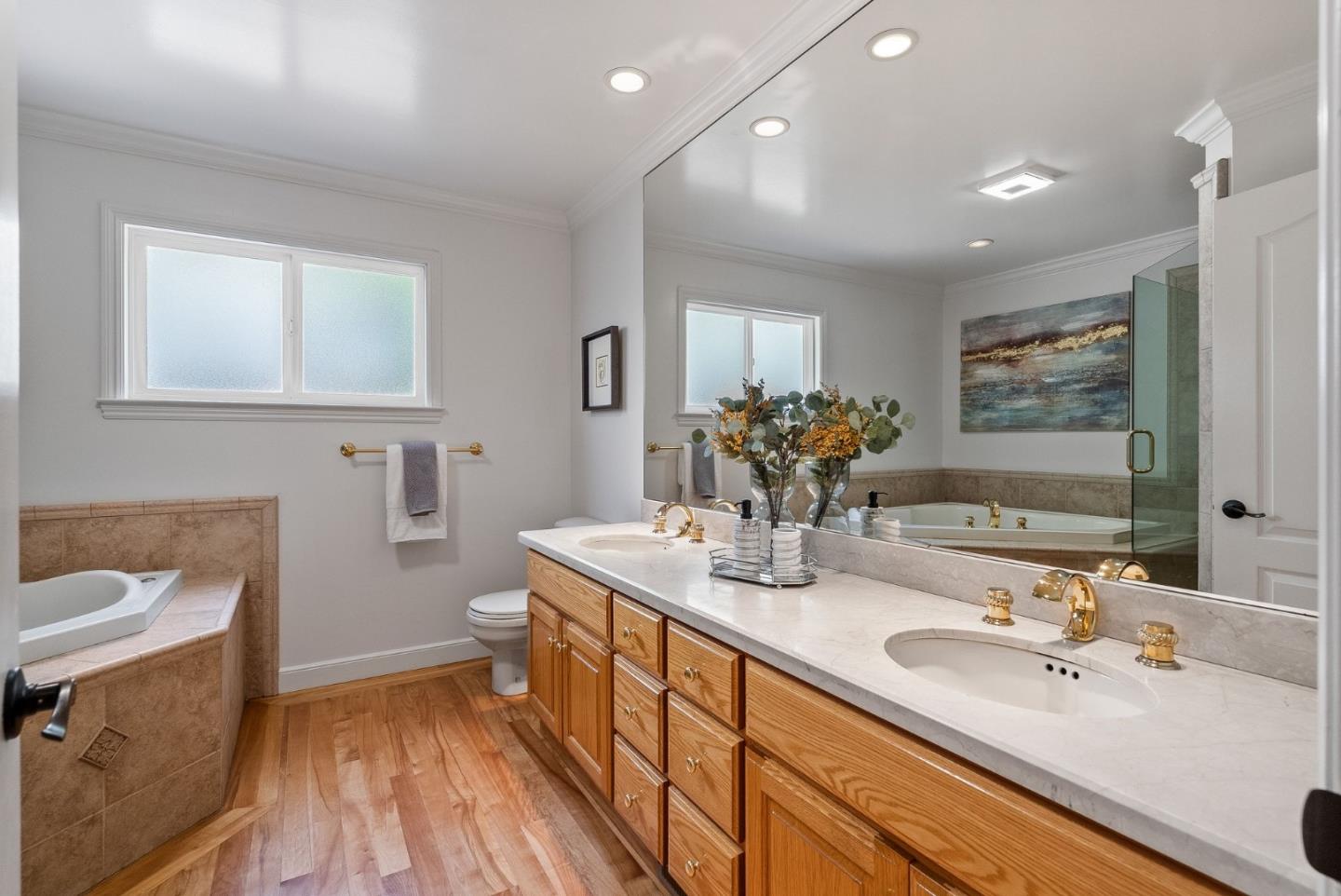 1127 Eastmoor Road Burlingame, CA 94010 - Photo 31 of 58 a bathroom with a sink double vanity granite and a mirror