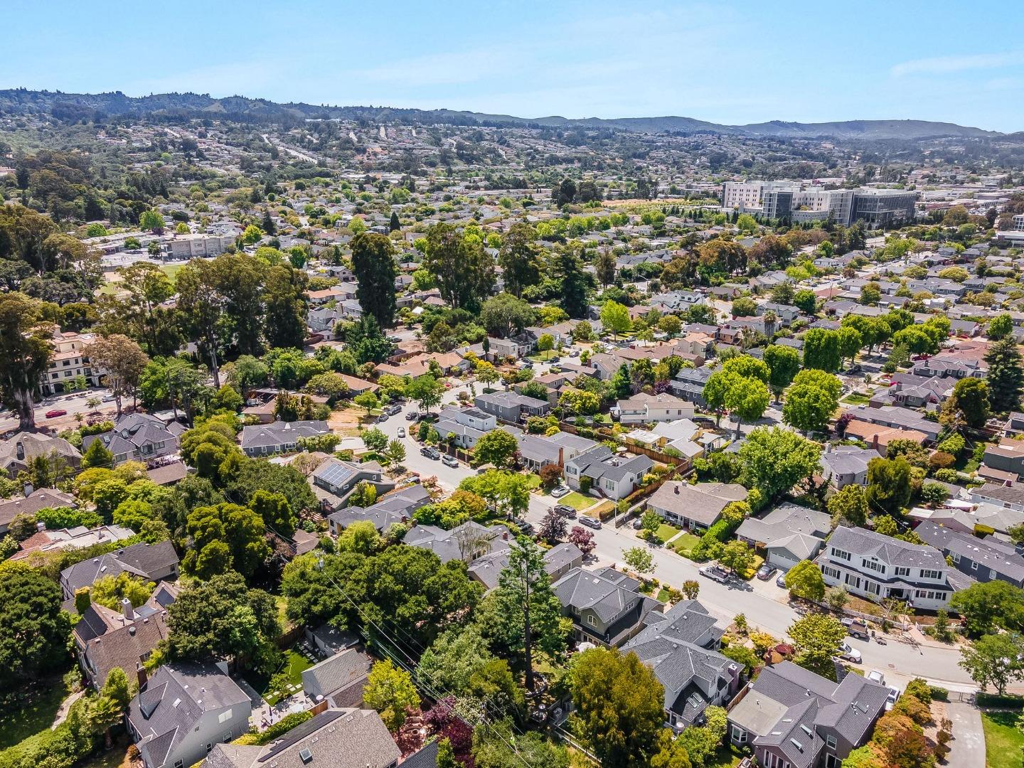 1127 Eastmoor Road Burlingame, CA 94010 - Photo 58 of 58 an aerial view of a houses with a lush green hillside
