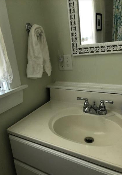 33R N Road Chilmark, MA 02535 - Photo 19 of 31 a bathroom with a sink and mirror