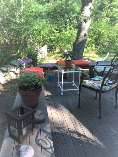 33R N Road Chilmark, MA 02535 - Photo 24 of 31 a view of an chairs and table in the patio