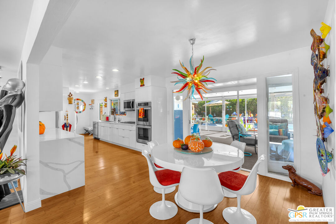 68401 Rodeo Road Cathedral City, CA 92234 - Photo 11 of 46 a living room with furniture and a floor to ceiling window