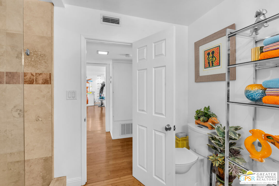 68401 Rodeo Road Cathedral City, CA 92234 - Photo 20 of 46 a bathroom with a sink mirror and toilet