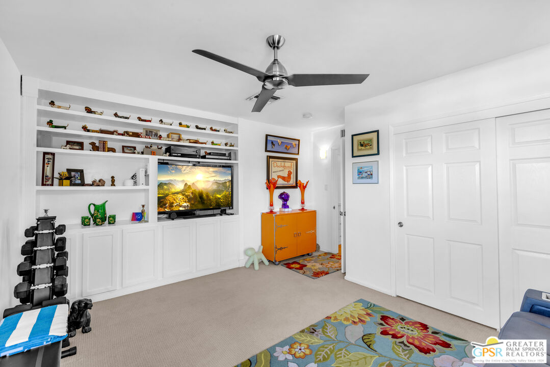 68401 Rodeo Road Cathedral City, CA 92234 - Photo 27 of 46 a living room with furniture and a flat screen tv