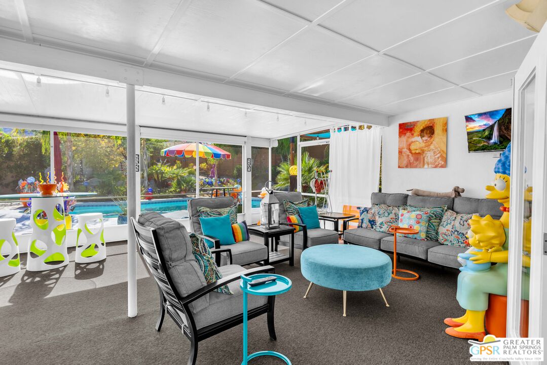 68401 Rodeo Road Cathedral City, CA 92234 - Photo 31 of 46 a living room with furniture and a large window